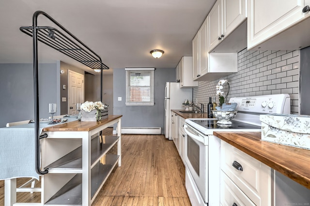 190 Wooster St Unit 27, New Haven, CT 06511 - kitchen featuring wooden counters, white appliances, baseboard heating, and a sink