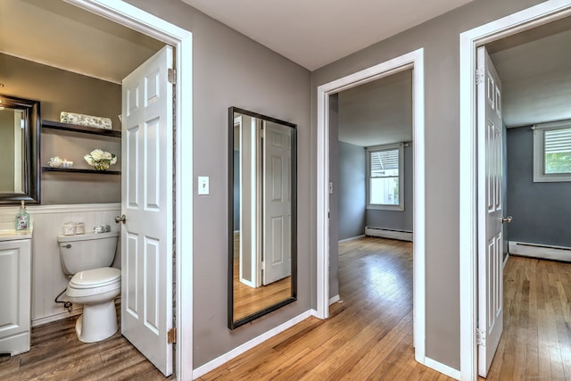190 Wooster St Unit 27, New Haven, CT 06511 - bathroom with baseboard heating, toilet, and hardwood / wood-style floors