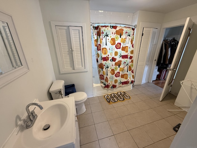 124 Richards St, West Haven, CT 06516 - full bathroom featuring a closet, toilet, vanity, tile patterned floors, and shower / tub combo with curtain
