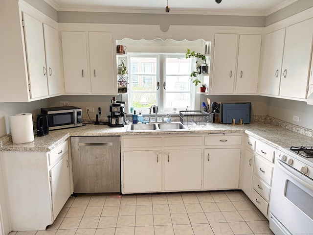124 Richards St, West Haven, CT 06516 - kitchen featuring appliances with stainless steel finishes, a sink, ornamental molding, light countertops, and light tile patterned floors