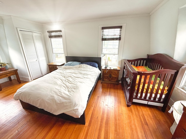 124 Richards St, West Haven, CT 06516 - bedroom with crown molding, a closet, and light wood-type flooring