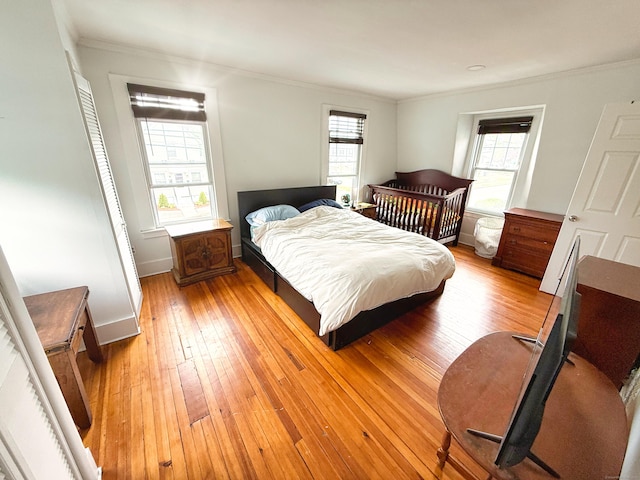 124 Richards St, West Haven, CT 06516 - bedroom with crown molding, light wood-style flooring, and baseboards