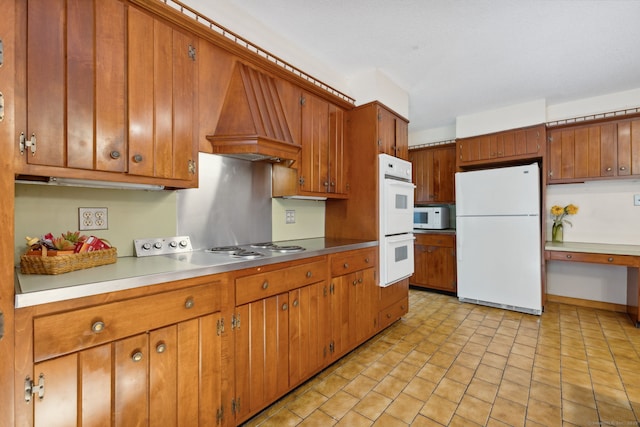 49 Longwood Dr, East Haddam, CT 06415 - kitchen featuring white appliances, custom exhaust hood, and brown cabinetry