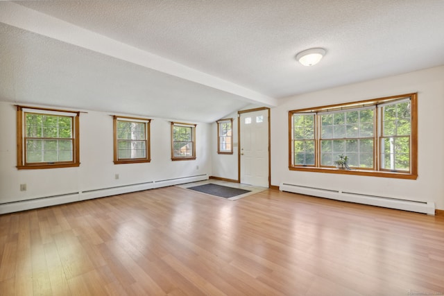 49 Longwood Dr, East Haddam, CT 06415 - empty room with baseboard heating, wood finished floors, and a textured ceiling