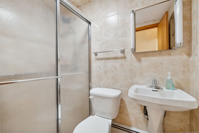 49 Longwood Dr, East Haddam, CT 06415 - bathroom with tile walls, toilet, an enclosed shower, decorative backsplash, and a baseboard heating unit
