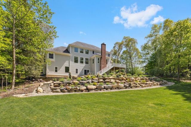 35 Bart Dr, Canton, CT 06019 - rear view of house with a chimney, a lawn, a wooden deck, and stairs