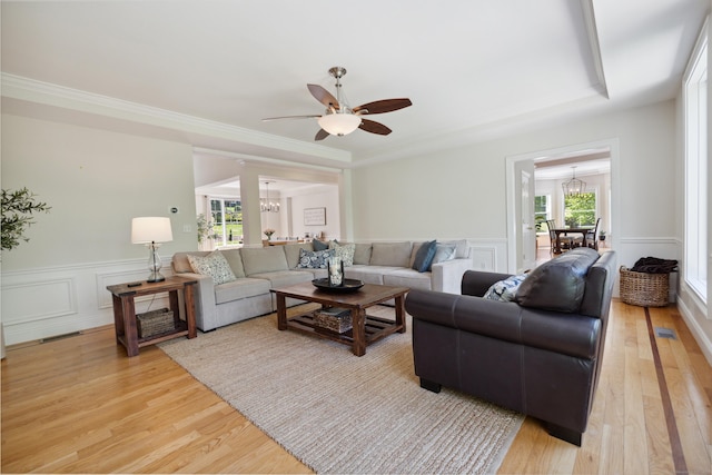 35 Bart Dr, Canton, CT 06019 - living area featuring a chandelier, light wood-style floors, a ceiling fan, a decorative wall, and wainscoting