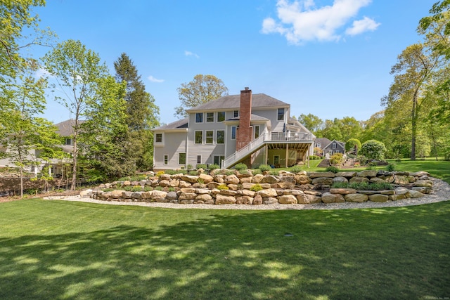 35 Bart Dr, Canton, CT 06019 - back of house featuring stairs, a wooden deck, a chimney, and a lawn
