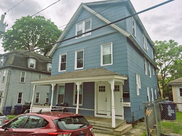 80 N St, Windham, CT 06226 - american foursquare style home featuring a porch