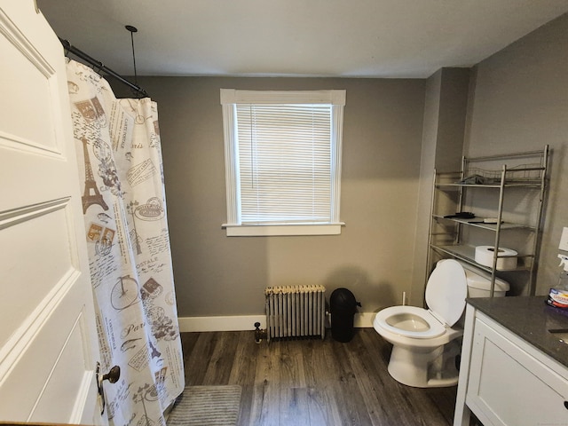 80 N St, Windham, CT 06226 - full bath featuring radiator, toilet, wood finished floors, vanity, and baseboards