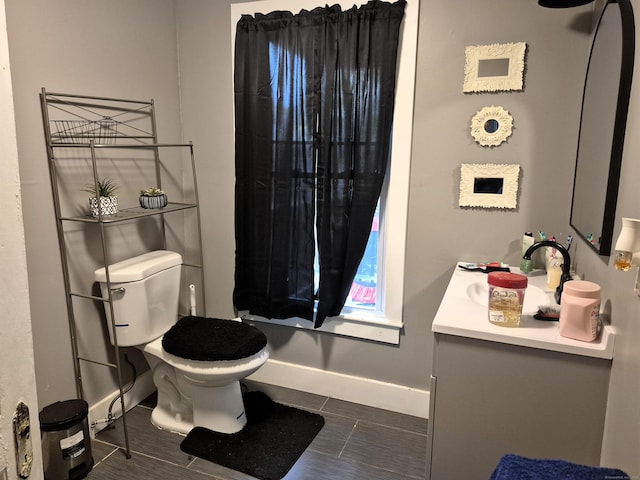 80 N St, Windham, CT 06226 - bathroom featuring vanity, baseboards, toilet, and tile patterned floors