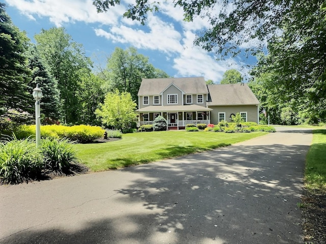 16 Trevor Ln, East Granby, CT 06026 - colonial house with a porch and a front lawn