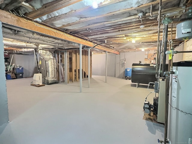 16 Trevor Ln, East Granby, CT 06026 - unfinished below grade area with oil tank and a water pressure tank