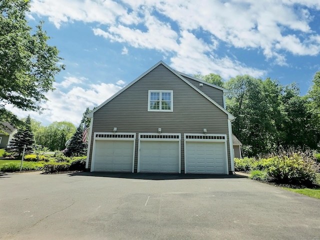 16 Trevor Ln, East Granby, CT 06026 - view of side of home with asphalt driveway