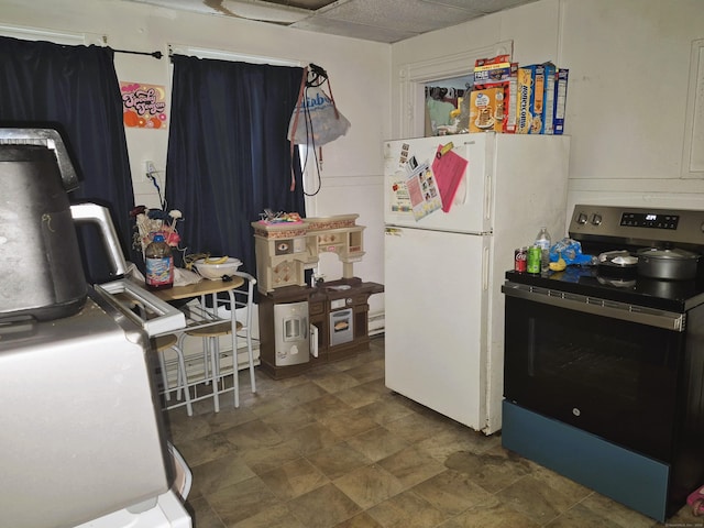 96 S St, Windham, CT 06226 - kitchen featuring electric stove, freestanding refrigerator, and stone finish floors