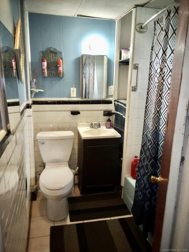 100 Roosevelt Ave, Torrington, CT 06790 - bathroom with toilet, tile patterned floors, shower / tub combo, tile walls, and vanity