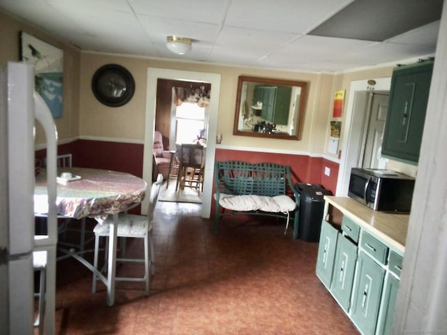 100 Roosevelt Ave, Torrington, CT 06790 - bedroom with freestanding refrigerator, a wainscoted wall, and a paneled ceiling