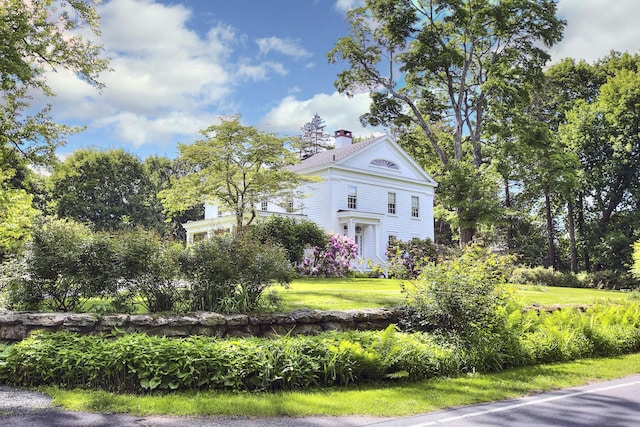 587 Carter St, New Canaan, CT 06840 - view of side of property featuring a chimney and a yard