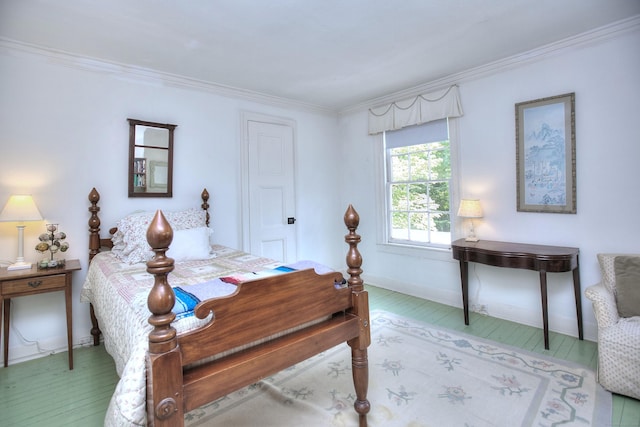 587 Carter St, New Canaan, CT 06840 - bedroom with ornamental molding, baseboards, and wood finished floors