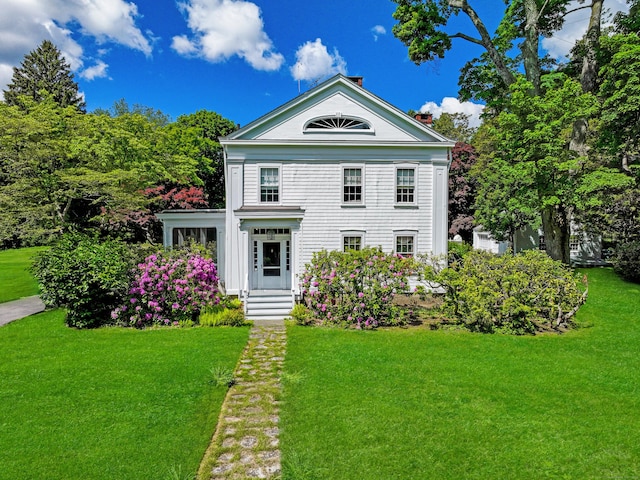 587 Carter St, New Canaan, CT 06840 - neoclassical / greek revival house featuring a front lawn and a chimney