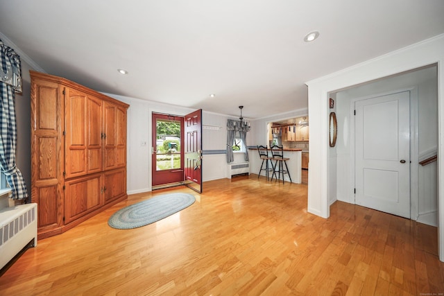 70 Cold Spring Cir, Naugatuck, CT 06770 - foyer featuring radiator heating unit, crown molding, light wood-style floors, recessed lighting, and baseboards