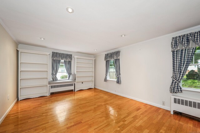 70 Cold Spring Cir, Naugatuck, CT 06770 - spare room with radiator, plenty of natural light, crown molding, wood finished floors, and recessed lighting