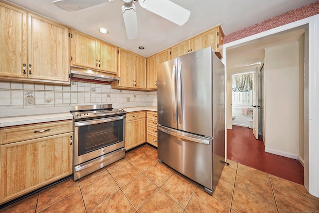 70 Cold Spring Cir, Naugatuck, CT 06770 - kitchen with appliances with stainless steel finishes, under cabinet range hood, light brown cabinetry, light countertops, and recessed lighting