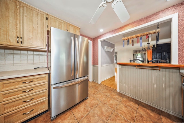 70 Cold Spring Cir, Naugatuck, CT 06770 - kitchen featuring freestanding refrigerator, a ceiling fan, wainscoting, light tile patterned flooring, and light countertops