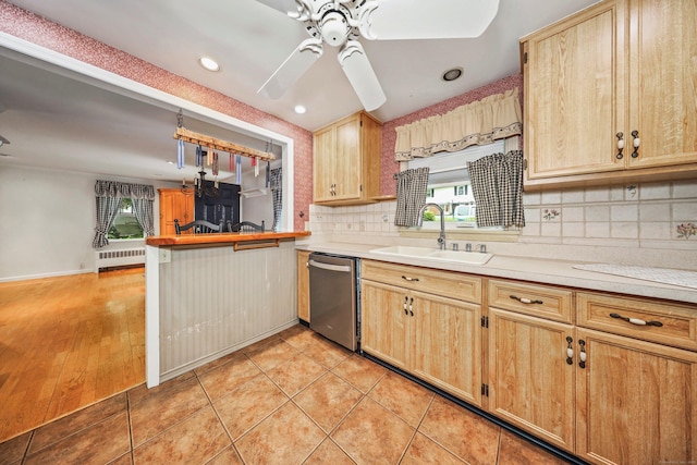 70 Cold Spring Cir, Naugatuck, CT 06770 - kitchen with dishwasher, a sink, a ceiling fan, backsplash, and a peninsula