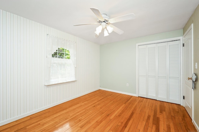 70 Cold Spring Cir, Naugatuck, CT 06770 - unfurnished bedroom featuring hardwood / wood-style flooring, a closet, baseboards, and a ceiling fan