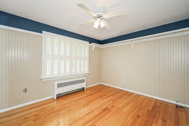70 Cold Spring Cir, Naugatuck, CT 06770 - spare room with radiator heating unit, wood-type flooring, a ceiling fan, and baseboards