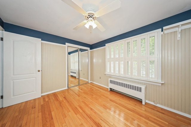 70 Cold Spring Cir, Naugatuck, CT 06770 - unfurnished bedroom with radiator heating unit, hardwood / wood-style floors, baseboards, and a ceiling fan