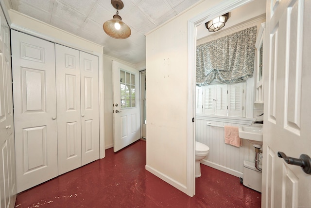 70 Cold Spring Cir, Naugatuck, CT 06770 - bathroom featuring toilet, baseboards, and concrete flooring