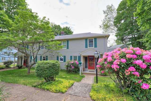 70 Cold Spring Cir, Naugatuck, CT 06770 - view of front of house with a front lawn and a chimney