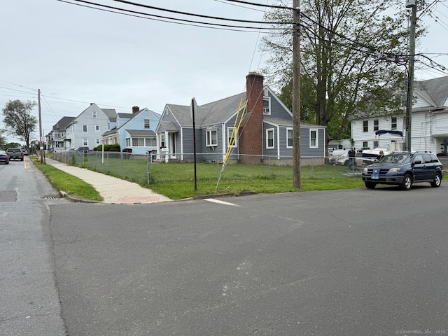 240 Beechmont Ave, Bridgeport, CT 06606 - view of asphalt street featuring a residential view, sidewalks, and curbs