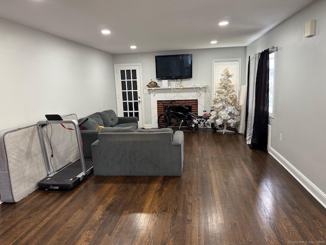 240 Beechmont Ave, Bridgeport, CT 06606 - living room with dark wood-type flooring, a fireplace, recessed lighting, and baseboards