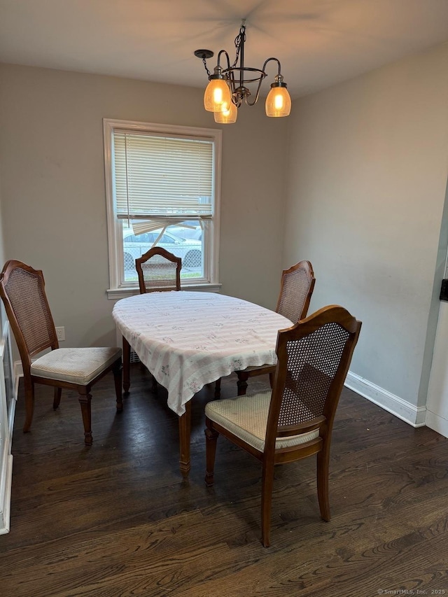 240 Beechmont Ave, Bridgeport, CT 06606 - dining room featuring dark wood-style flooring, baseboards, and a chandelier