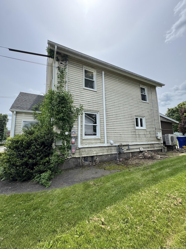 160 New Litchfield St, Torrington, CT 06790 - back of property featuring a yard and ac unit