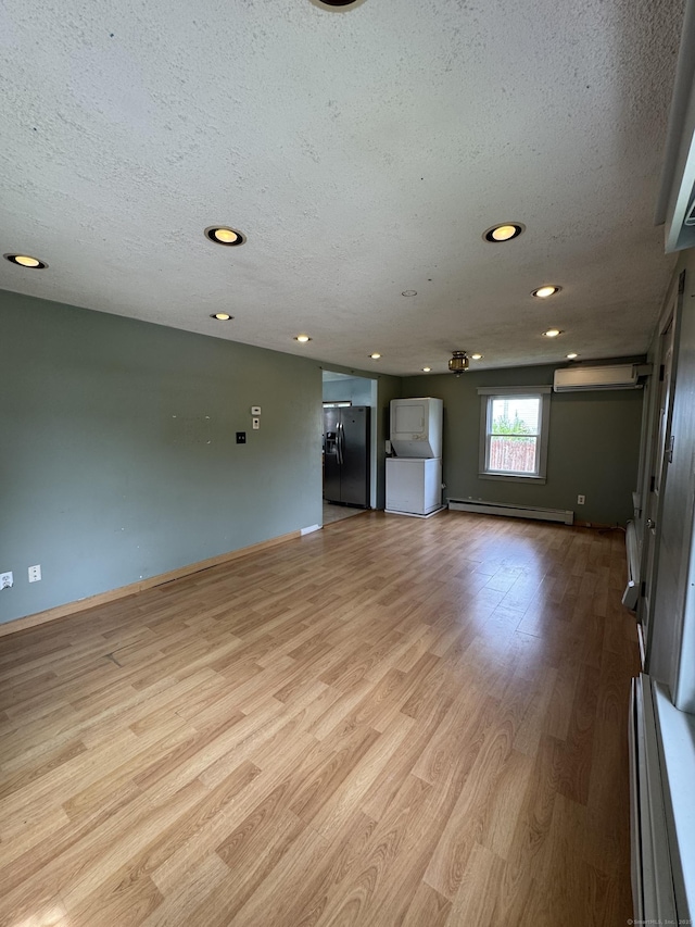 160 New Litchfield St, Torrington, CT 06790 - spare room with a textured ceiling, light wood-style floors, baseboard heating, recessed lighting, and baseboards