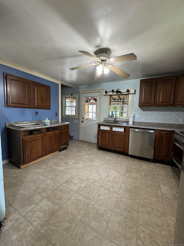 160 New Litchfield St, Torrington, CT 06790 - kitchen with appliances with stainless steel finishes, a sink, a ceiling fan, and decorative backsplash