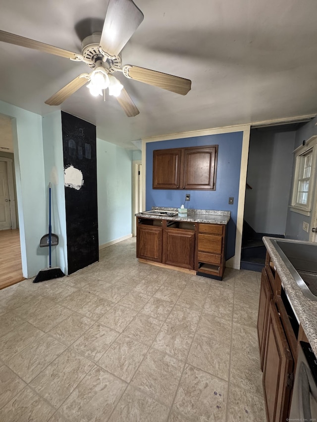 160 New Litchfield St, Torrington, CT 06790 - kitchen with a ceiling fan and brown cabinets