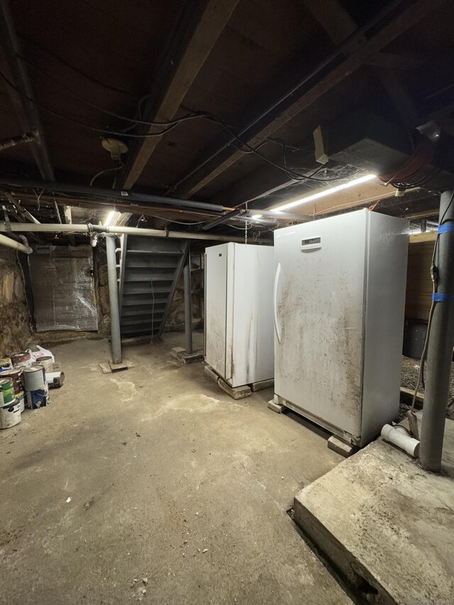 160 New Litchfield St, Torrington, CT 06790 - unfinished below grade area with freestanding refrigerator