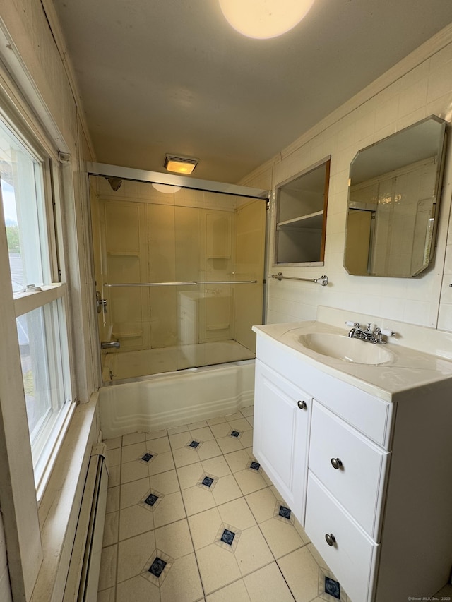 160 New Litchfield St, Torrington, CT 06790 - full bathroom featuring tile patterned flooring, vanity, plenty of natural light, and bath / shower combo with glass door