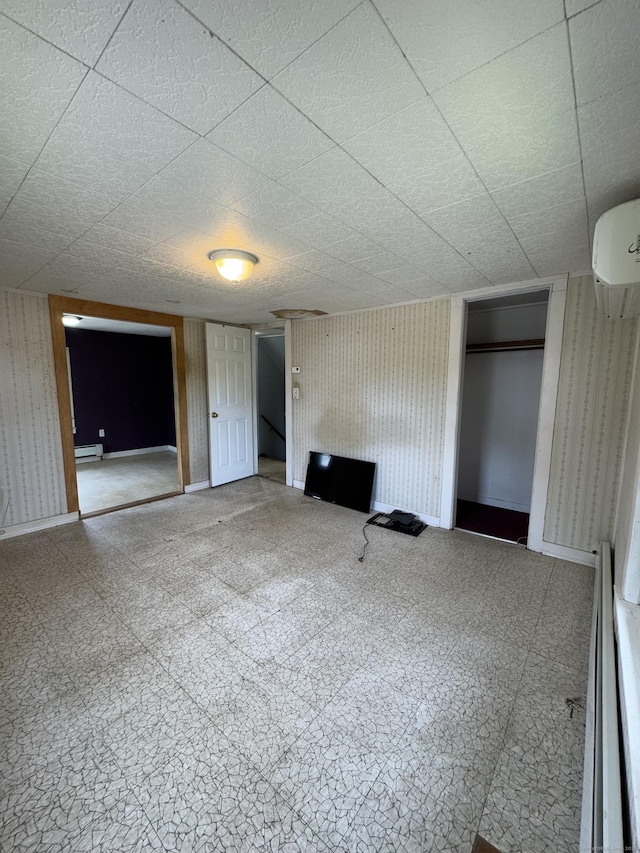 160 New Litchfield St, Torrington, CT 06790 - empty room featuring tile patterned floors, a baseboard radiator, and wallpapered walls