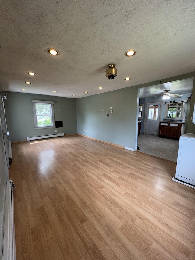 160 New Litchfield St, Torrington, CT 06790 - unfurnished living room with light wood-style floors, a textured ceiling, ceiling fan, recessed lighting, and baseboards