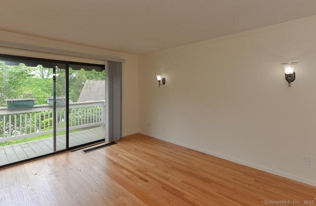 8 Heritage Vlg Unit D, Southbury, CT 06488 - spare room featuring crown molding, light wood-style flooring, and baseboards