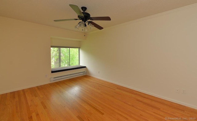 8 Heritage Vlg Unit D, Southbury, CT 06488 - spare room with a baseboard heating unit, ornamental molding, light wood-style flooring, baseboards, and a ceiling fan
