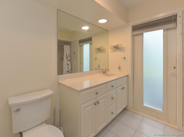8 Heritage Vlg Unit D, Southbury, CT 06488 - full bathroom with tile patterned floors, vanity, toilet, and recessed lighting