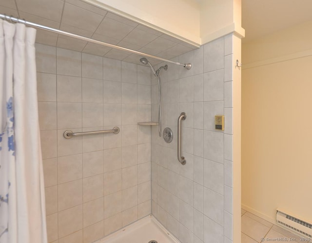 8 Heritage Vlg Unit D, Southbury, CT 06488 - full bath featuring baseboard heating, tiled shower, and tile patterned floors