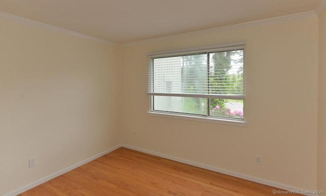 8 Heritage Vlg Unit D, Southbury, CT 06488 - unfurnished room with light wood-style floors, crown molding, and baseboards